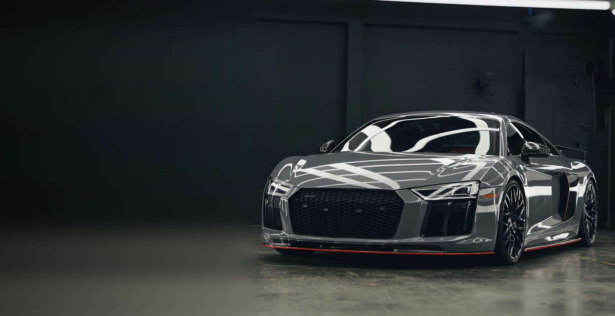 A grey sports coupe in the Auto Showroom showroom